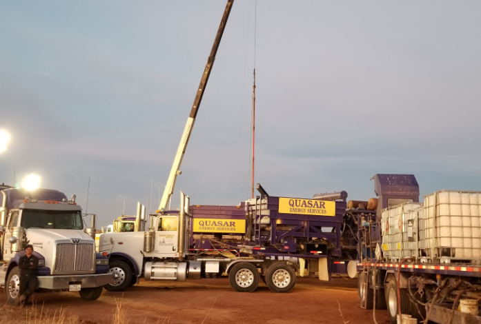 Crane moving large equipment